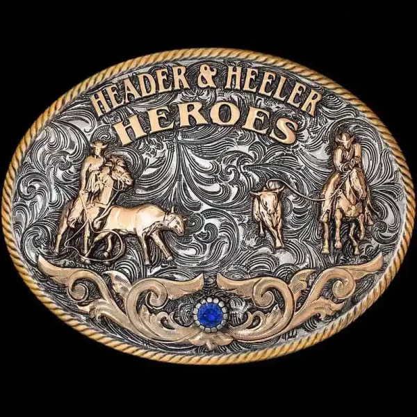 "Our Clovis Classic Buckle captures the grit & dedication roping partners share, truly making them Header & Heeler Heroes. This Buckle is crafted on a German Silver base with an antique finish to give a rustic feel. It is detailed with a Jewe